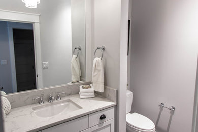Example of an arts and crafts powder room design in Seattle