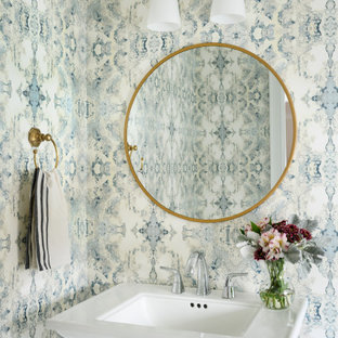 Inspiration for a mid-sized transitional wallpaper powder room remodel in Boston with a pedestal sink, blue walls and a freestanding vanity