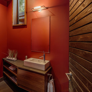 Ispirazione per un bagno di servizio minimal con lavabo a bacinella, ante lisce e ante in legno scuro