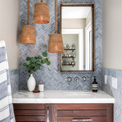Powder room - transitional powder room idea in Orange County with shaker cabinets, dark wood cabinets, beige walls, an undermount sink and white countertops