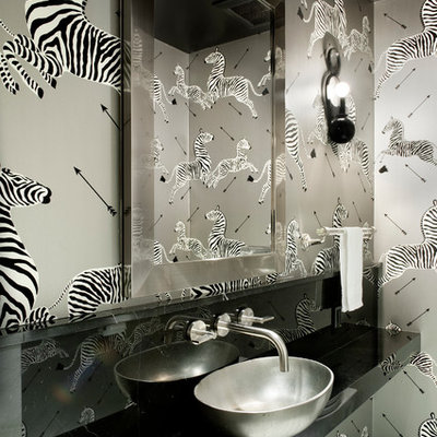 Trendy powder room photo in New York with a vessel sink and gray walls
