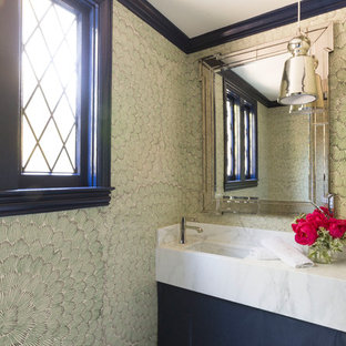 Inspiration for a mid-sized transitional powder room remodel in San Francisco with flat-panel cabinets, black cabinets, green walls, an undermount sink, marble countertops and white countertops