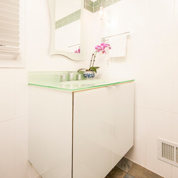 Contemporary Powder Room with Glass Vanity Cabinet