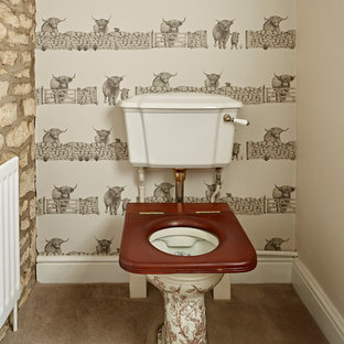 Medium sized victorian cloakroom in London with a two-piece toilet and brown floors.