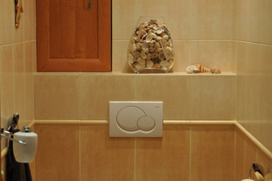 Example of a trendy powder room design in London