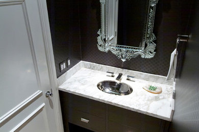 Example of a transitional powder room design in Miami