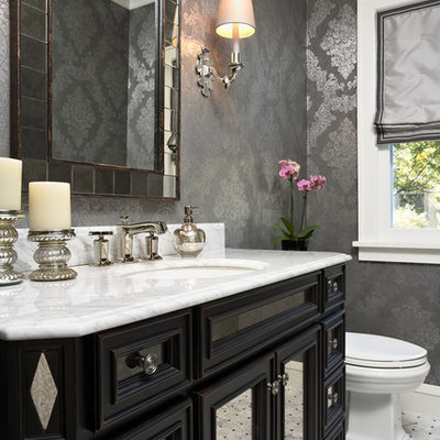Powder room - traditional powder room idea in Minneapolis with an undermount sink, recessed-panel cabinets, black cabinets and white countertops