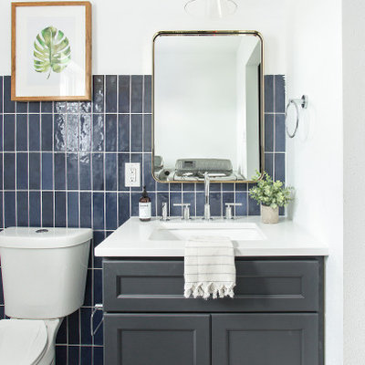Mid-sized transitional white tile and ceramic tile powder room photo in Dallas with shaker cabinets, blue cabinets, quartz countertops and white countertops