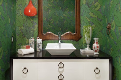 Example of a trendy powder room design in Orange County with a vessel sink, furniture-like cabinets and white cabinets