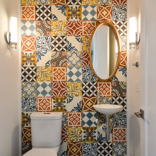 Powder room - small contemporary multicolored tile and ceramic tile porcelain tile and gray floor powder room idea in Charleston with a two-piece toilet, multicolored walls and a wall-mount sink