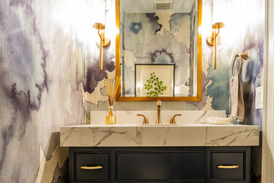 Powder room - mid-sized transitional white floor powder room idea in Charlotte with beaded inset cabinets, black cabinets, white countertops, multicolored walls and marble countertops