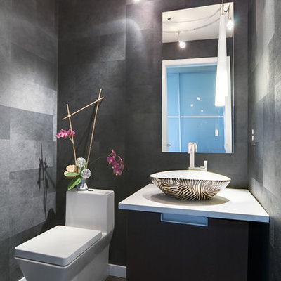 Inspiration for a small modern powder room remodel in Denver with a vessel sink and gray walls