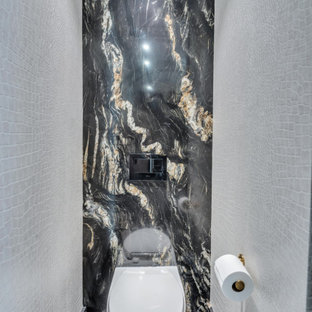 Immagine di un ampio bagno di servizio shabby-chic style con consolle stile comò, ante nere, WC sospeso, piastrelle nere, piastrelle di marmo, pareti beige, pavimento in marmo, lavabo sospeso, top in quarzite, pavimento nero, top nero e mobile bagno sospeso