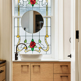 Mid-sized contemporary powder room in Adelaide with flat-panel cabinets, medium wood cabinets, white walls, a vessel sink, white benchtops and a floating vanity.