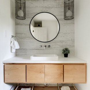 Example of a trendy powder room design in Austin