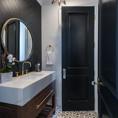 Powder room - mid-sized traditional black tile and porcelain tile cement tile floor and white floor powder room idea in Los Angeles with furniture-like cabinets, dark wood cabinets, a one-piece toilet, white walls, an undermount sink, tile countertops and white countertops