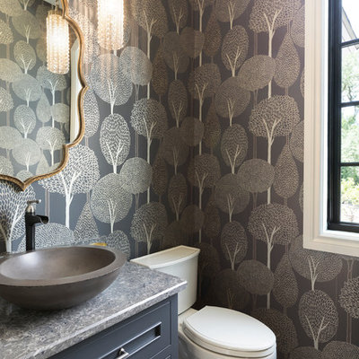 Inspiration for a large mediterranean ceramic tile and multicolored floor powder room remodel in Minneapolis with blue cabinets, a two-piece toilet, a vessel sink, quartz countertops, gray countertops, recessed-panel cabinets and multicolored walls