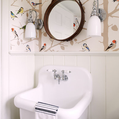 Transitional wall paneling, wainscoting and wallpaper powder room photo in Philadelphia with multicolored walls and a wall-mount sink