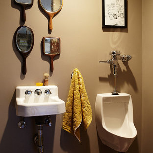 Powder room - eclectic powder room idea in Los Angeles with a wall-mount sink and an urinal