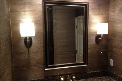 Example of a transitional powder room design in Detroit