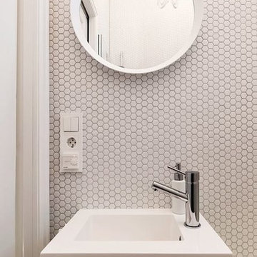 Modern white powder room with hexagon mosaic