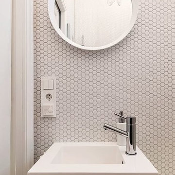 Modern white powder room with hexagon mosaic
