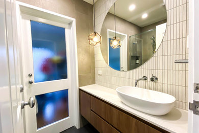 Modern cloakroom in Melbourne with a trough sink and a floating vanity unit.