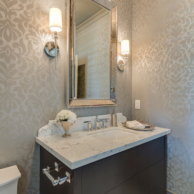 Example of a mid-sized classic white tile porcelain tile powder room design in Vancouver with an undermount sink, flat-panel cabinets, dark wood cabinets, granite countertops, gray walls and white countertops