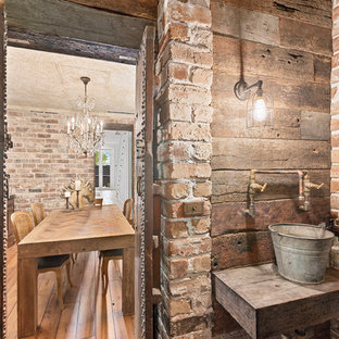 Photo of a country powder room in Sydney with brown walls, a vessel sink, wood benchtops and brown benchtops.