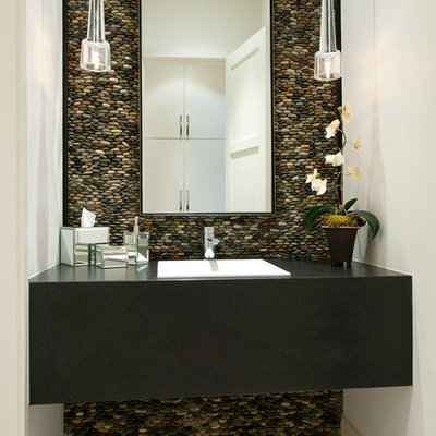 Inspiration for a contemporary pebble tile and gray tile powder room remodel in Dallas with a drop-in sink