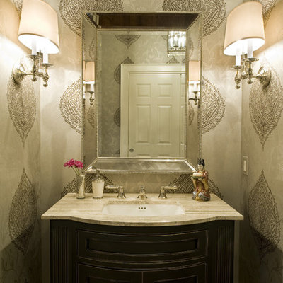 Elegant powder room photo in Philadelphia with an undermount sink and beige countertops