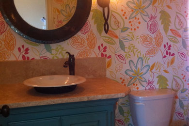 Example of a transitional powder room design in Austin