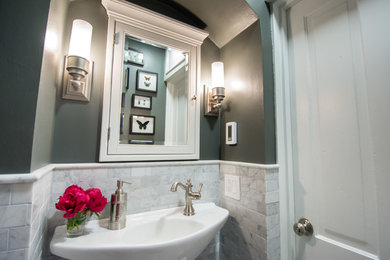 Example of a transitional powder room design in Other
