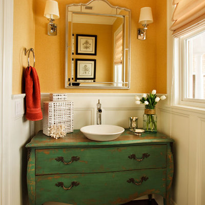 Small elegant dark wood floor powder room photo in Portland with a vessel sink, furniture-like cabinets and green cabinets