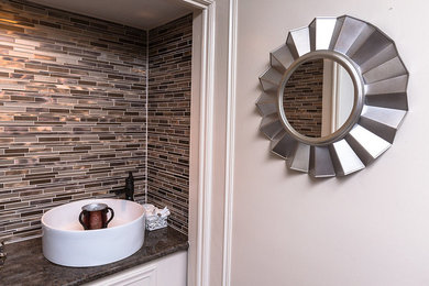Example of a trendy powder room design in Houston