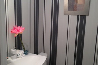Inspiration for a contemporary powder room remodel in Toronto