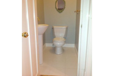 Inspiration for a small timeless powder room remodel in Chicago with a two-piece toilet and a pedestal sink