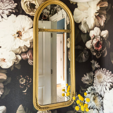 Powder room with brass fixtures