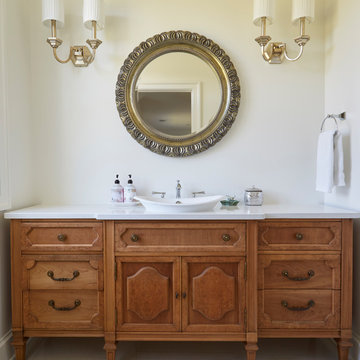 Powder Room with Furniture-Style Vanity and Ornate Mirror