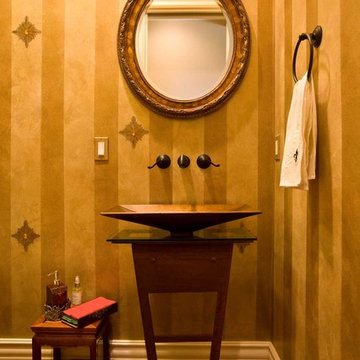 powder room with gold paint with jewels and metal pedestal sink