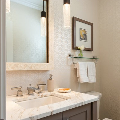 Powder room - mid-sized transitional powder room idea in Boston with an undermount sink, dark wood cabinets, quartzite countertops, beige walls and shaker cabinets