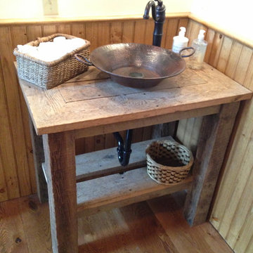 Reclaimed wood vanity with hammered copper vessel sink
