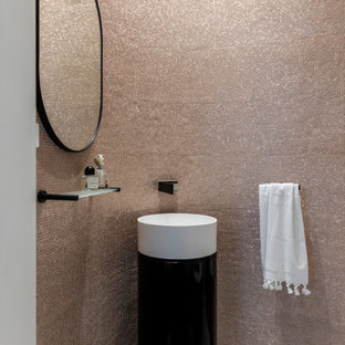 Design ideas for a contemporary powder room in Sydney with beige tile, mosaic tile, a console sink and grey floor.