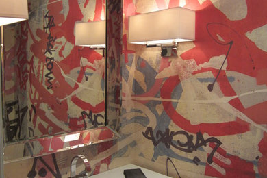 Example of a trendy powder room design in Austin with white countertops