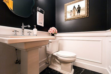 Ispirazione per un piccolo bagno di servizio chic con lavabo a colonna, WC a due pezzi, piastrelle nere e pareti nere