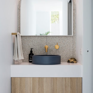 Design ideas for a beach style powder room in Sunshine Coast with flat-panel cabinets, light wood cabinets, a vessel sink, white benchtops and a floating vanity.