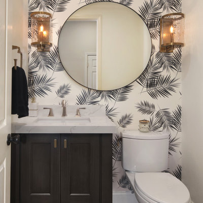 Inspiration for a transitional medium tone wood floor and brown floor powder room remodel in Los Angeles with shaker cabinets, black cabinets, a two-piece toilet, white walls, an undermount sink, marble countertops and multicolored countertops