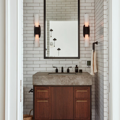 Transitional white tile gray floor powder room photo in Philadelphia with flat-panel cabinets, dark wood cabinets, an undermount sink and gray countertops