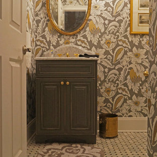 Example of a small classic black and white tile and stone tile marble floor powder room design in Philadelphia with raised-panel cabinets, distressed cabinets, a two-piece toilet, multicolored walls, an undermount sink and marble countertops
