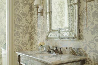 Elegant beige tile powder room photo in Miami with an undermount sink, multicolored walls and multicolored countertops
